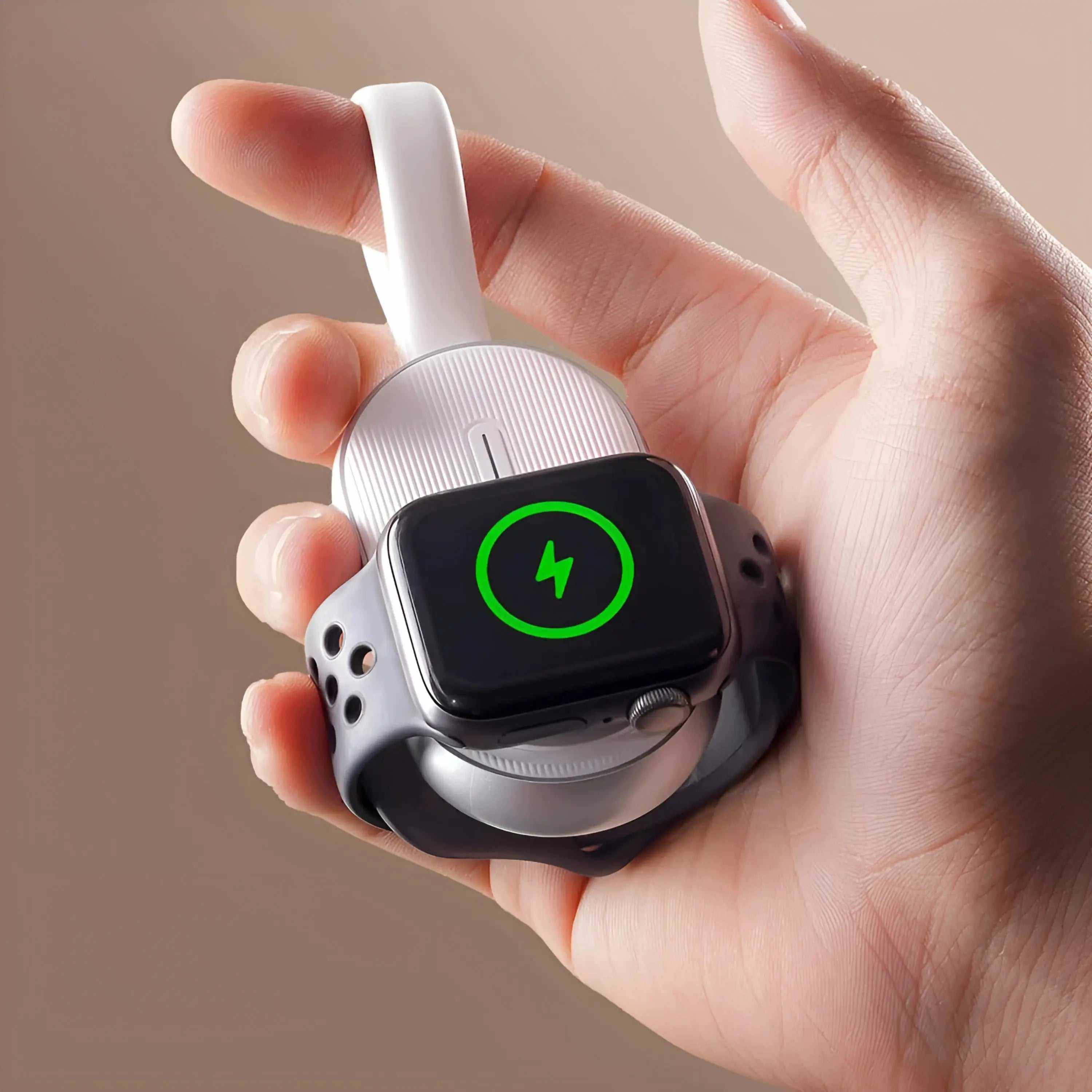 Hand holding Novoa WatchBank Pro Apple Watch power bank with magnetic charging and LED indicator